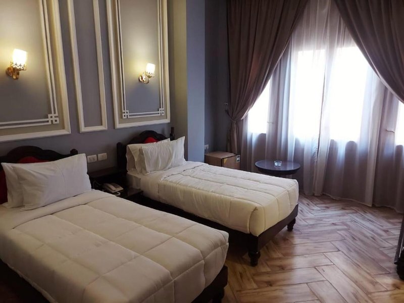 Cosmopolitan Plaza INN Hotel 16 - Room Example